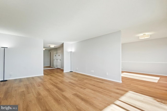 unfurnished living room featuring light wood-type flooring