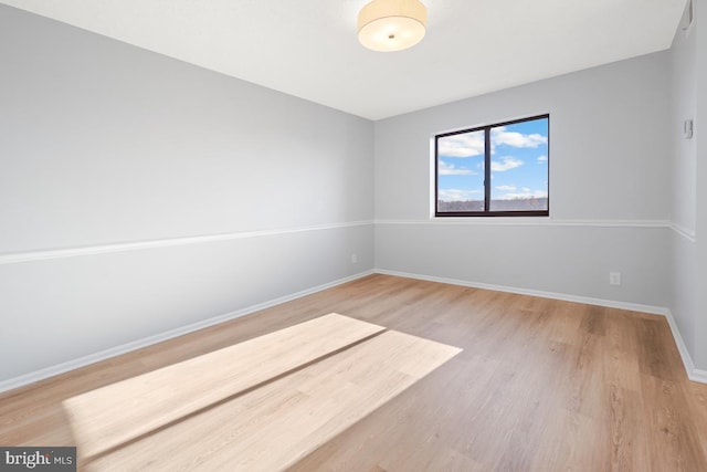 spare room featuring hardwood / wood-style flooring