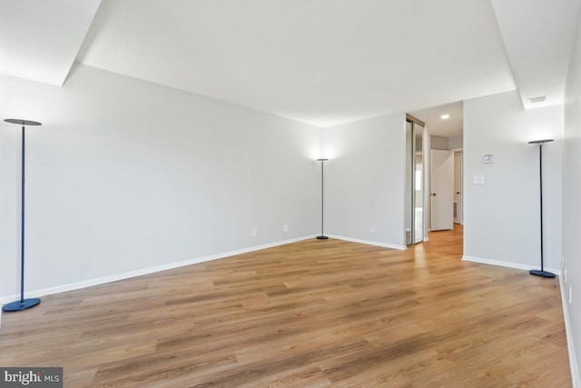 spare room with light hardwood / wood-style flooring