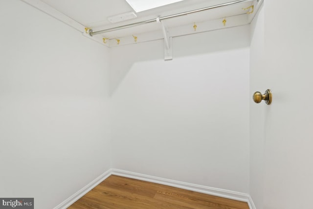 walk in closet featuring hardwood / wood-style floors