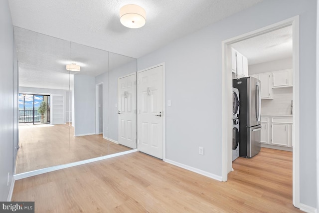 interior space featuring light hardwood / wood-style floors and a textured ceiling