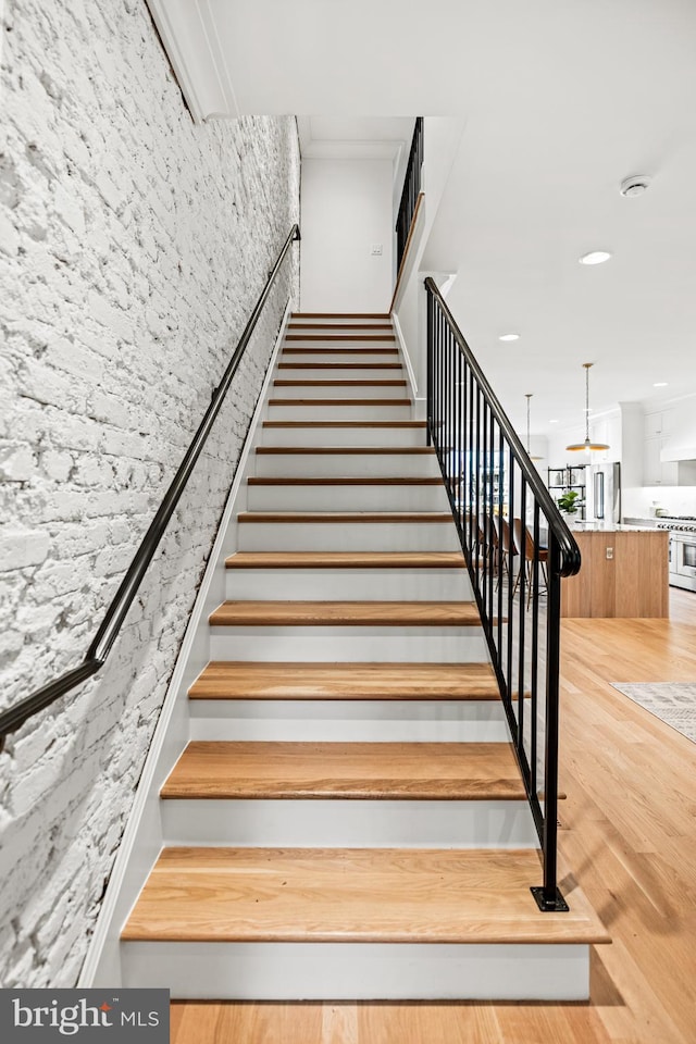 stairs with wood-type flooring