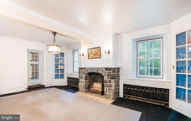 living room featuring radiator heating unit, beamed ceiling, a fireplace, and dark hardwood / wood-style floors