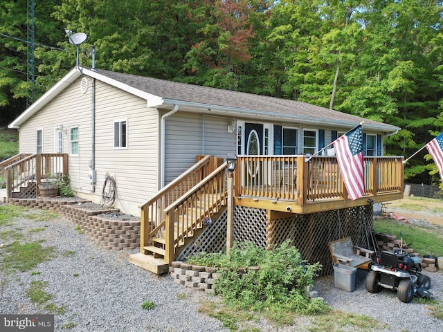 back of house featuring a deck