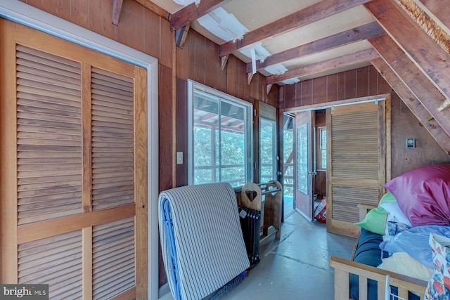 interior space featuring lofted ceiling with beams