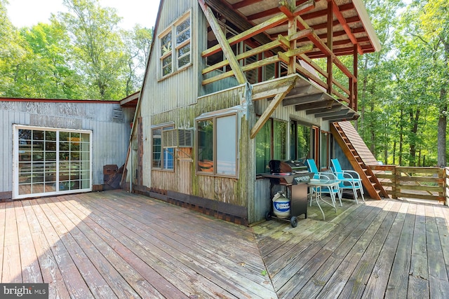 wooden terrace featuring grilling area