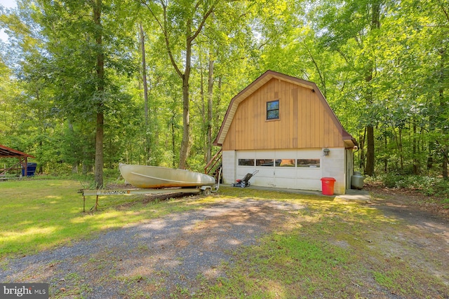 garage featuring a lawn