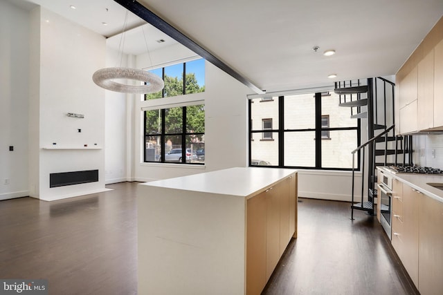 kitchen featuring a center island and dark hardwood / wood-style floors