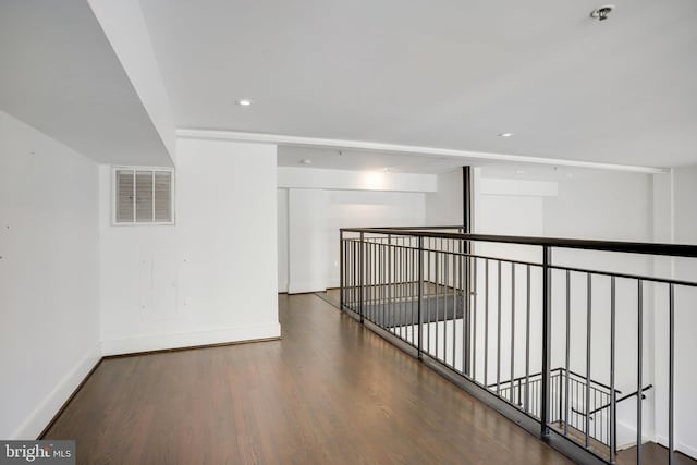 corridor featuring dark hardwood / wood-style flooring