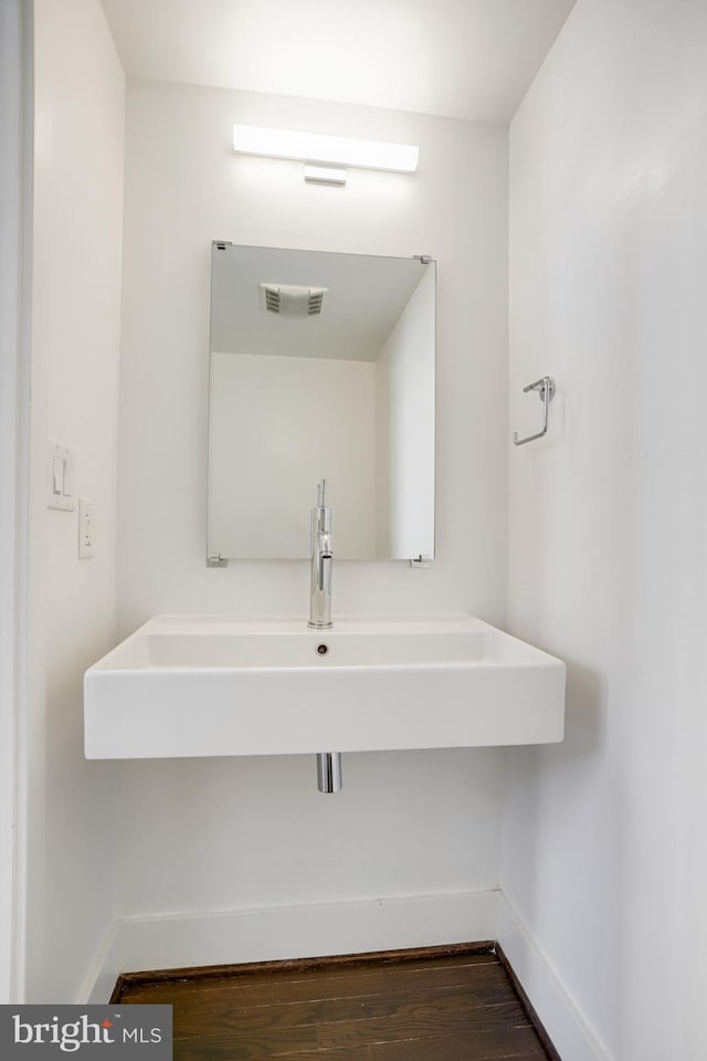 bathroom featuring hardwood / wood-style floors and sink