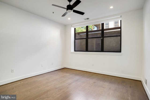 unfurnished room featuring hardwood / wood-style flooring and ceiling fan