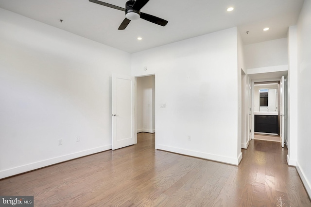 unfurnished bedroom featuring light wood-type flooring and ceiling fan