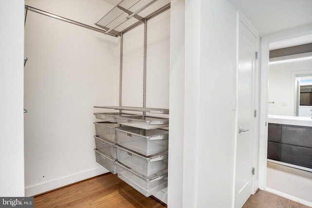 walk in closet featuring light wood-type flooring