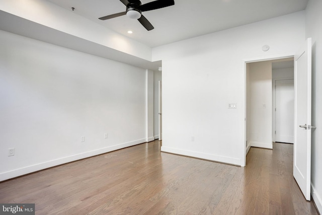 unfurnished bedroom with ceiling fan and light hardwood / wood-style floors