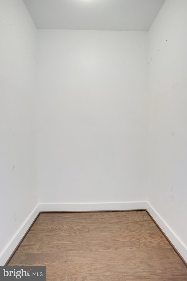 unfurnished room featuring wood-type flooring