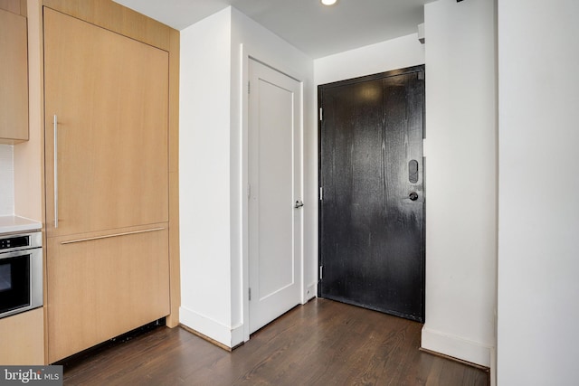 interior space with dark wood-type flooring