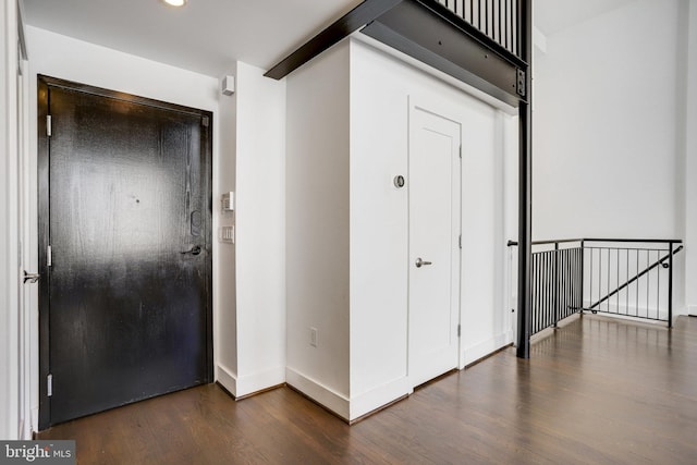 entryway featuring dark wood-type flooring