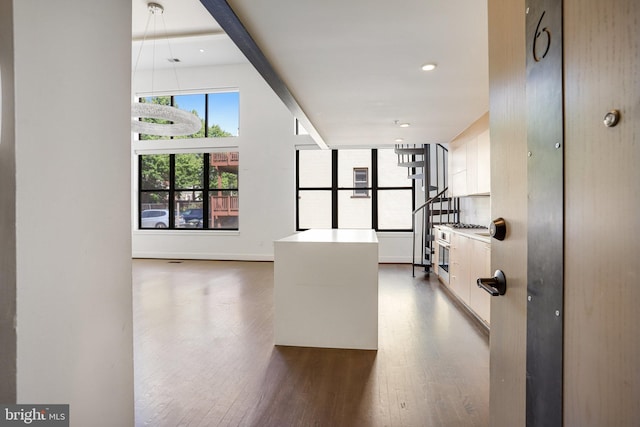 hall with wood-type flooring