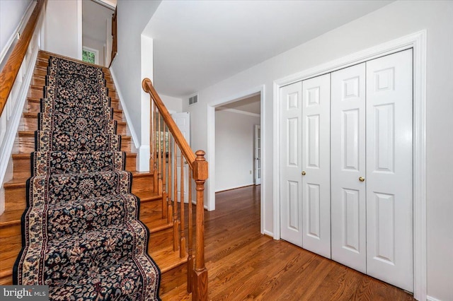 stairway with wood-type flooring