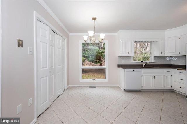 kitchen with a chandelier, white dishwasher, white cabinets, and light tile patterned flooring