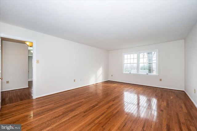 empty room featuring wood-type flooring