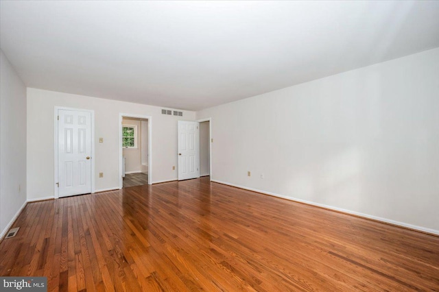 empty room featuring hardwood / wood-style floors