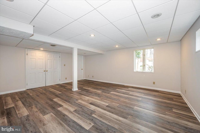 basement featuring dark hardwood / wood-style floors