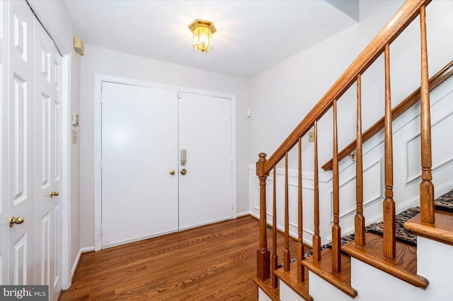 foyer featuring dark wood-type flooring