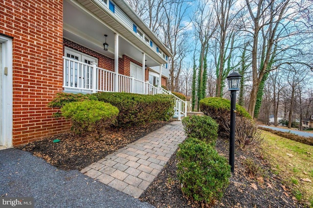 view of property exterior with covered porch