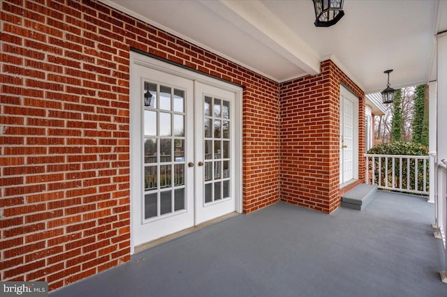 view of patio / terrace featuring french doors and a porch