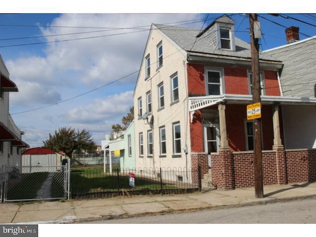 view of side of property featuring a porch