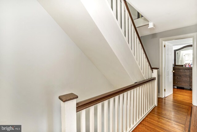 bedroom featuring hardwood / wood-style flooring, radiator, and ceiling fan