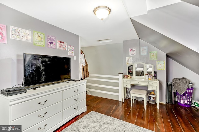 bedroom with dark hardwood / wood-style flooring