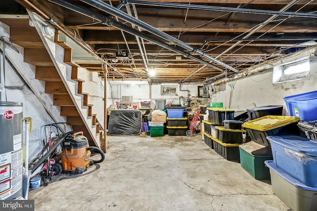 basement with stairs and gas water heater