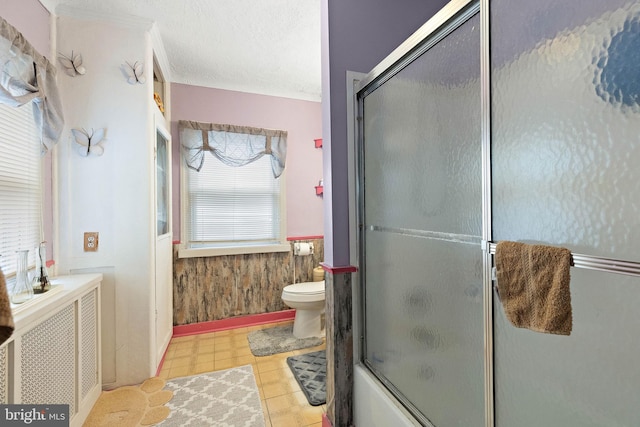 full bathroom with plenty of natural light, toilet, independent shower and bath, and wooden walls