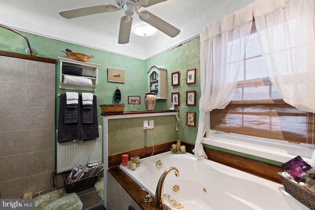 bathroom featuring ceiling fan and a bathtub