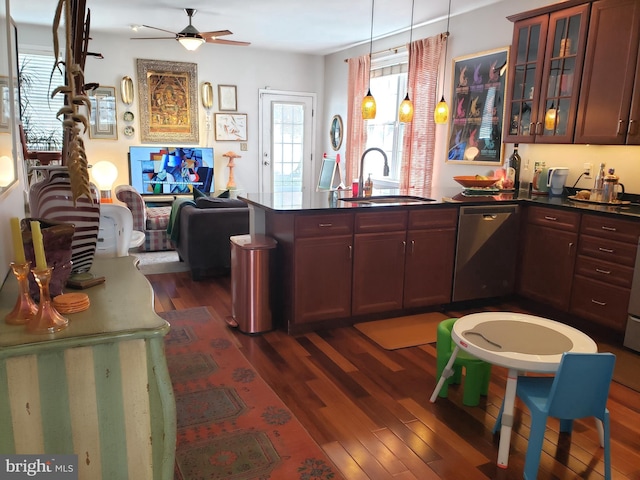 kitchen featuring pendant lighting, sink, ceiling fan, dark hardwood / wood-style floors, and stainless steel dishwasher