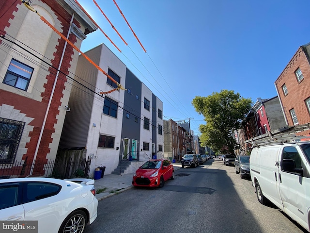 view of road with curbs and sidewalks