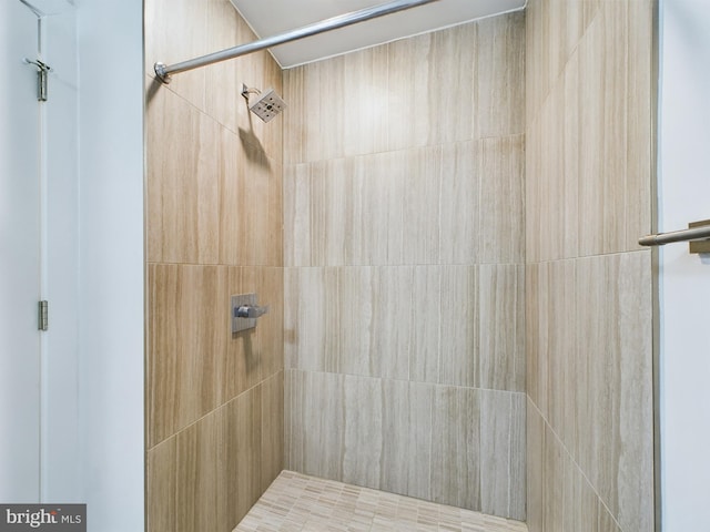 bathroom with a tile shower