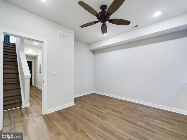 empty room featuring wood-type flooring and ceiling fan