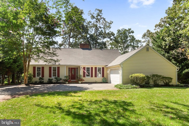 ranch-style house with a garage and a front yard