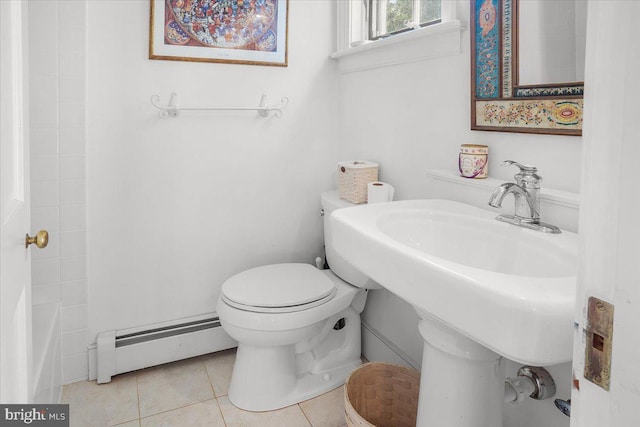 bathroom featuring a baseboard radiator, a sink, toilet, and tile patterned floors