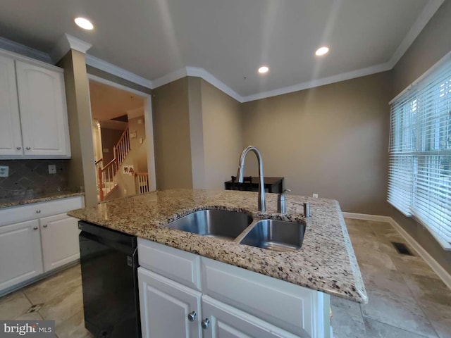 kitchen featuring white cabinets, dishwasher, a kitchen island with sink, and a healthy amount of sunlight