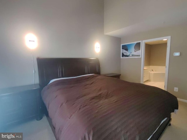 bedroom featuring carpet floors and ensuite bath