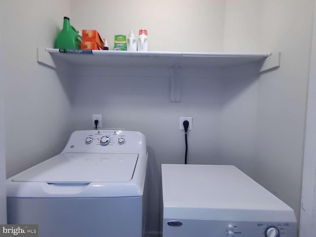 washroom with washer / clothes dryer