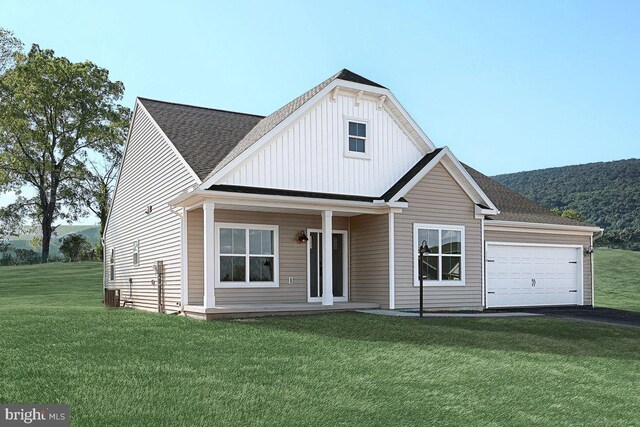 exterior space featuring central air condition unit, a garage, and a front lawn