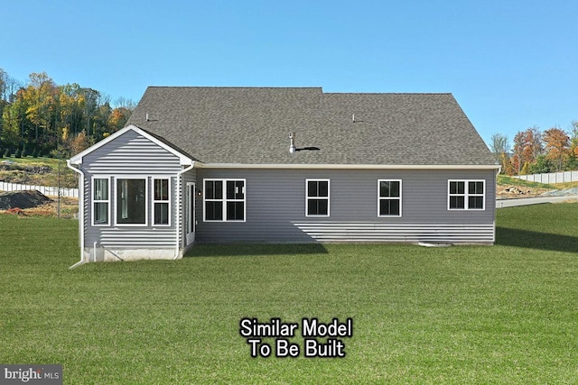 rear view of house with a lawn