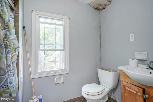 bathroom featuring vanity and toilet