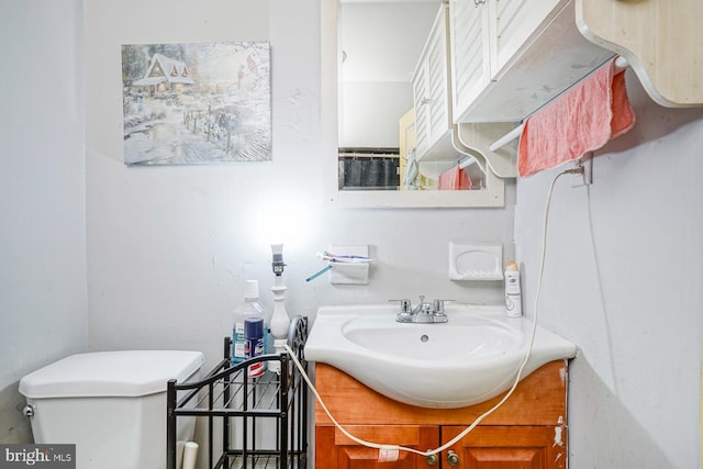 bathroom with vanity and toilet