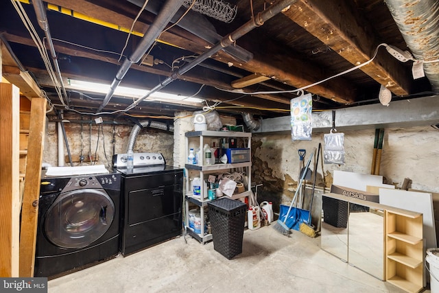 basement with washer and clothes dryer